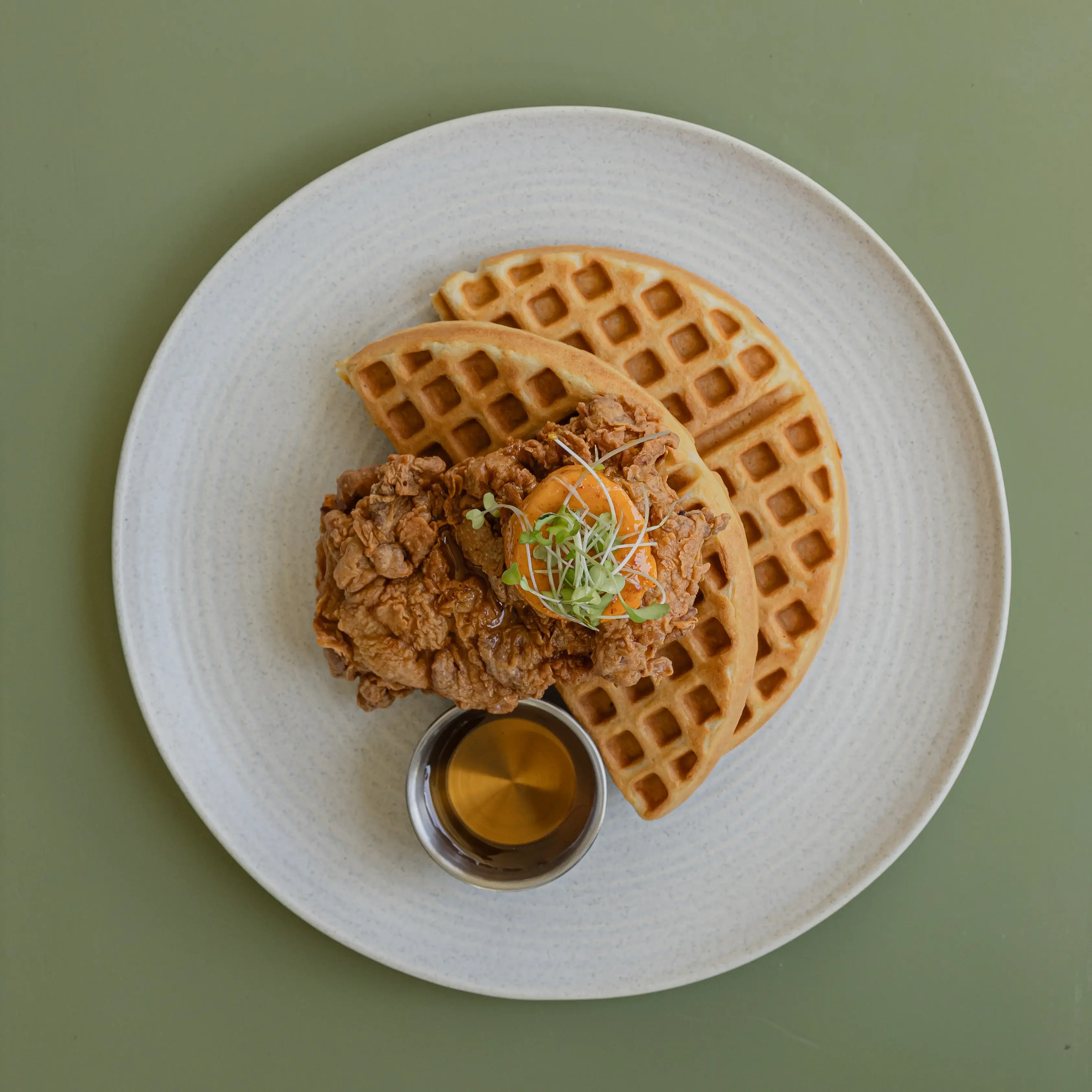 Southern fried chicken and waffles, gochujang butter, maple syrup
